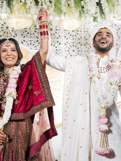 Pure victory and happiness! The couple celebrates their union at the end of their wedding ceremony.