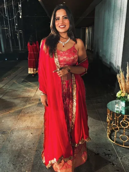 A full-length shot of my red wedding guest outfit. It was a simple, classic look that made me feel great.