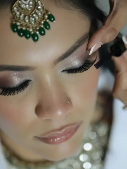 The difference is in the details. This close-up shot shows the precision I use when applying false lashes, which are always included to enhance the eyes. Every element, no matter how small, is perfected to create a flawless finish.