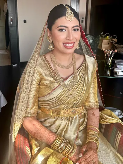 A beautiful, happy smile from the bride on her Nikah day. The natural light highlights her flawless skin and the classic elegance of the makeup.