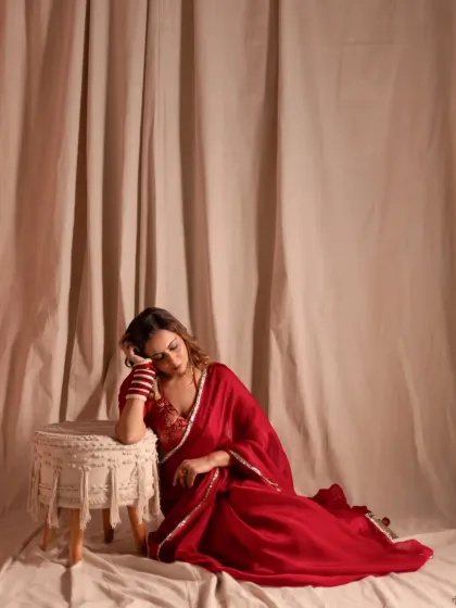 A moment of rest during the shoot can often lead to the most beautiful images. This candid-style portrait feels gentle and vulnerable, telling a story of quiet elegance.