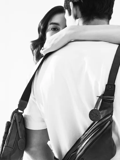 An artistic black and white shot for Kompanero, with the model's face partially hidden. It creates a sense of intimacy and intrigue.