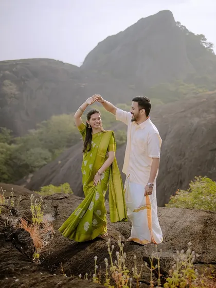 A beautiful dancing pose on the rocky terrain. The movement in her saree adds elegance and dynamism to the shot.