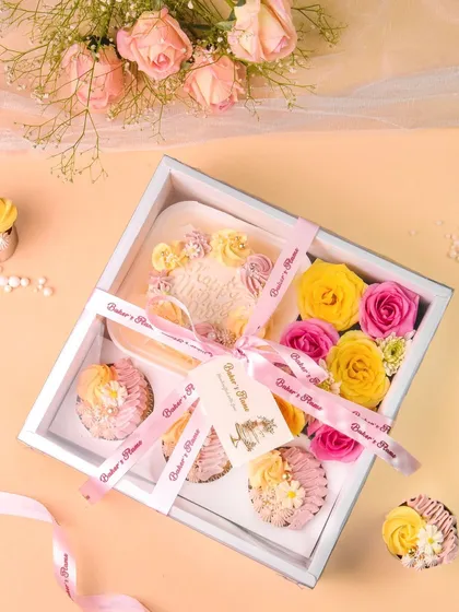 A beautifully packaged bakery gift box with a ribbon and tag, ready for gifting.