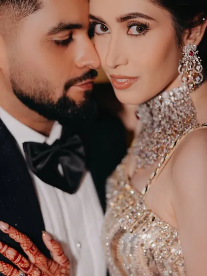 The story is in the details. This close-up portrait captures the intense connection and quiet confidence of a couple on their engagement night, highlighting the stunning jewelry and the palpable chemistry between them.