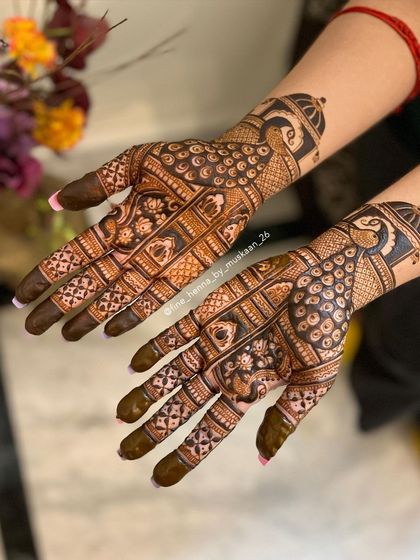 A lovely roka mehndi with peacock motifs. The design is dense but elegant, perfect for the start of wedding festivities.