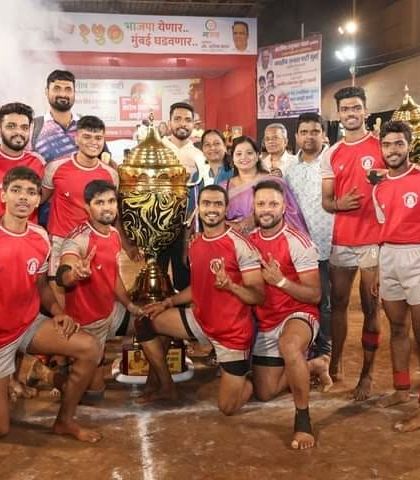 A celebratory shot on the mat with the trophy after winning the final match.