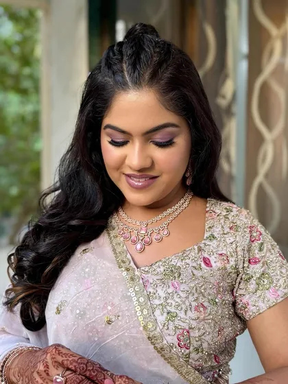 Reception glam magic. This look features a beautiful pop of purple on the eyes, paired with glowing skin and a soft lip.