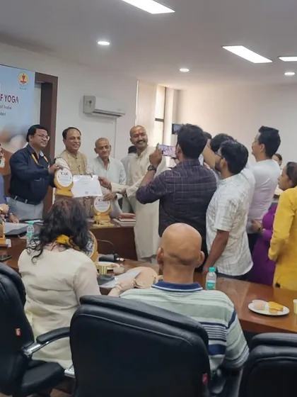 A wider view of the ceremony where we were honored by the Ministry of AYUSH. This recognition is a celebration for our entire community of teachers, students, and supporters who make our work possible.
