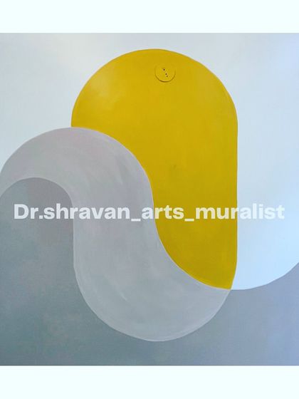 When in doubt, go minimalistic. This abstract mural plays with overlapping shapes and a simple color palette of yellow and grey to create a sophisticated and modern look.