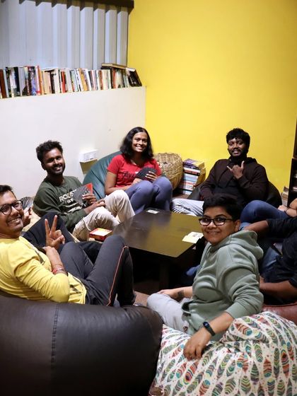 A larger group takes over the bean bag area for a lively game night. My space is flexible enough to accommodate groups of all sizes for fun and connection.