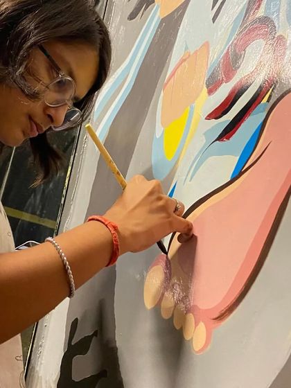 A close-up look at the painting process for the academy mural. I use high-quality acrylic paints to ensure the colors are vibrant and long-lasting, even in a high-traffic area like this.