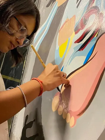 A close-up look at the painting process for the academy mural. I use high-quality acrylic paints to ensure the colors are vibrant and long-lasting, even in a high-traffic area like this.