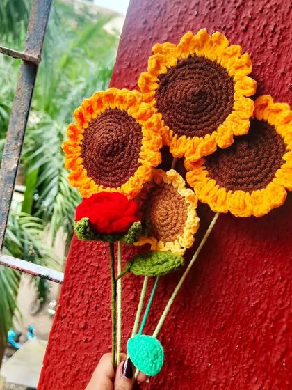 A handful of sunshine! This little bunch includes my crochet sunflowers and a single red rose, showing how you can start to build your own custom bouquet.