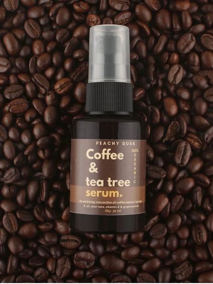 My Coffee & Tea Tree serum, set against a backdrop of coffee beans. This potent blend is perfect for targeting specific skin concerns and delivering powerful results.