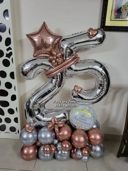 A 25th anniversary balloon bouquet in rose gold and silver.