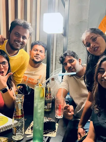 A group of friends celebrating a birthday, showing that K-OS is the perfect spot for any occasion.