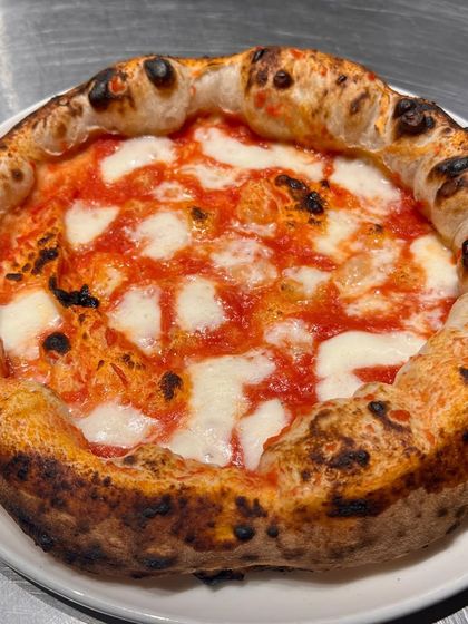 A beautiful Margherita from one of our dough trial sessions. Even when we're testing, we can't resist making a classic.