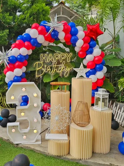I love creating fun, themed birthday parties for kids. This Spiderman celebration features character cutouts, a custom red, white, and blue balloon arch, and a large light-up marquee number to mark the special day.