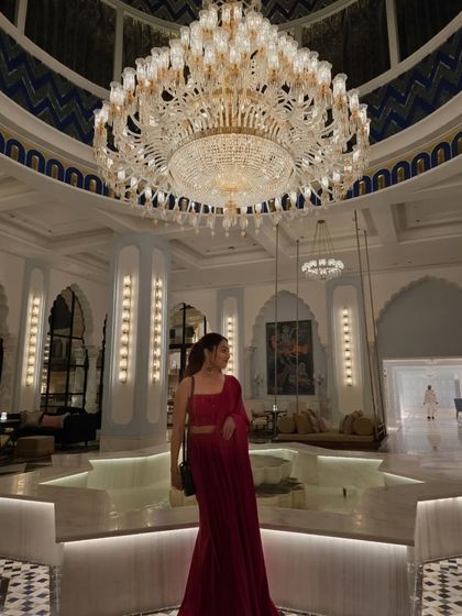 A moment of quiet elegance in a beautiful red saree at the Fairmont hotel in Udaipur. The grandeur of the location called for an equally grand and classic outfit.