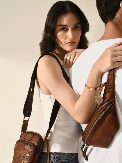 A beautifully lit commercial shot for Kompanero, highlighting the texture and craftsmanship of the leather bags.