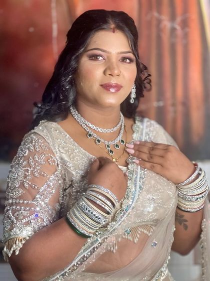 A close-up of the client, showing her confidence. The soft curls and simple hairstyle frame her face beautifully.