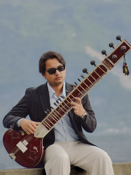 A playful moment in Lausanne, Switzerland, inspired by the "Peaky Blinders" style. It shows my contemporary side and the joy I find in blending tradition with modern aesthetics, whether in music or in life.