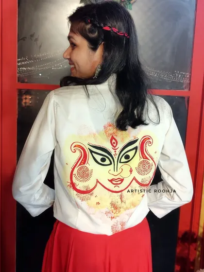 Here is a close-up of the finished hand-painted Durga design on a custom shirt. The bold lines, vibrant colors, and intricate details are designed to make a statement and celebrate the divine feminine energy during Navratri.