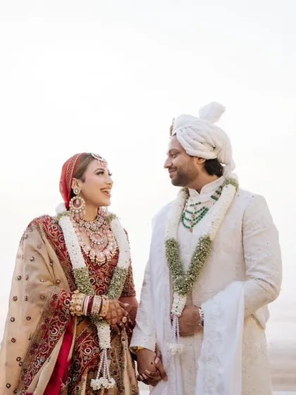A classic portrait against a serene beach backdrop. We plan destination weddings that offer stunning natural scenery for your couple photoshoots.