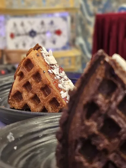 A slice of our classic waffle, perfectly golden and ready for toppings. A simple yet satisfying dessert.