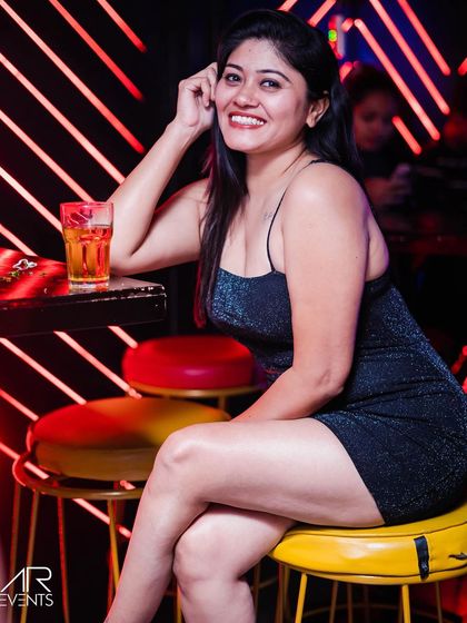 A guest enjoying a drink at the bar.