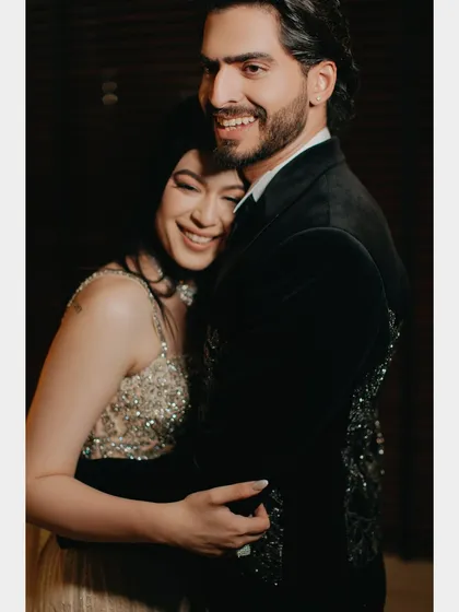 Beyond the grand events, we seek the real, unscripted moments. This candid embrace captures the pure joy and comfort two people find in each other, a quiet moment of connection amidst the celebration. This is the heart of our candid couple photography.