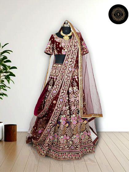Rent our gorgeous lehengas to dazzle on your special occasion. This maroon velvet lehenga with intricate floral embroidery is a royal choice for a winter wedding.
