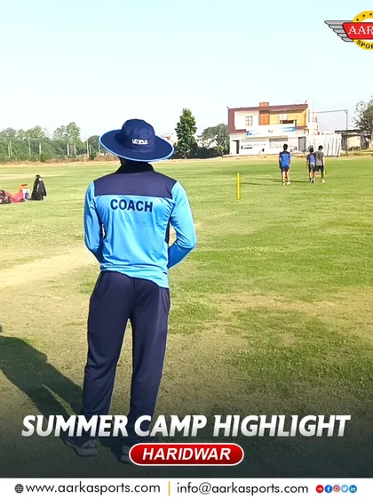 A coach watches over the field during the summer camp. Their experience and guidance are invaluable to the students.