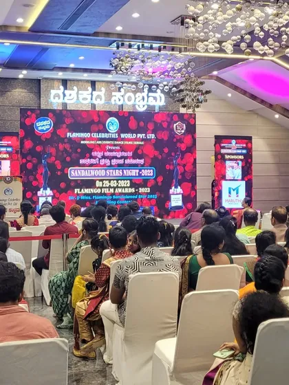 I can manage large-scale awards nights and corporate functions, like this "Sandalwood Stars Night". The setup included a large LED backdrop, professional stage lighting, and seating arrangements for a large audience, ensuring the entire event ran smoothly.