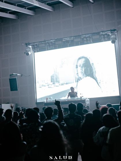 A black and white visual of me on the big screen, creating a powerful, artistic moment during the set.