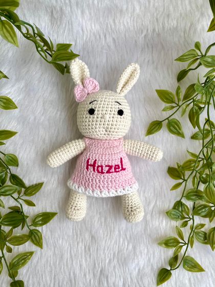This bunny doll is personalized with the name "Hazel" on her pretty pink dress. Customizing a doll with a name makes it an extra special and personal keepsake.