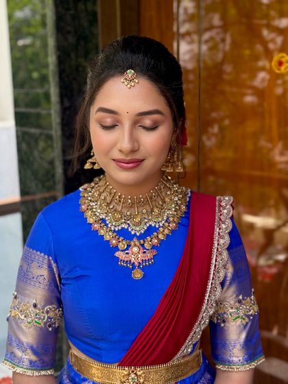 A close-up of the makeup for the bangle ceremony, featuring soft eyeshadow and perfectly defined features.
