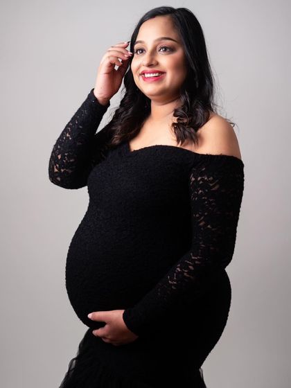 A simple, elegant pose that showcases the beauty of pregnancy. My goal is to make you feel confident and radiant in front of the camera.