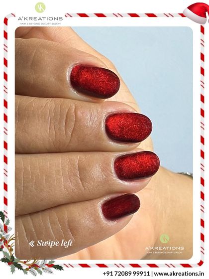 A close-up of the rich texture and deep color of our red velvet Christmas nails, showing the beautiful shimmer effect.