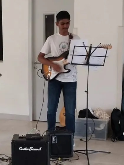 Our student guitarist, fully equipped with his electric guitar and amplifier, plays during the "Goan Masala" performance that got everyone dancing.