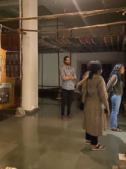 Visitors exploring the different components of the 'WEAVING LIGHT' installation.