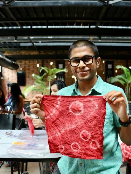 A participant from our brewery workshop showing off his unique red tie-dye napkin. The patterns are always a fun surprise, and his creation turned out fantastic.