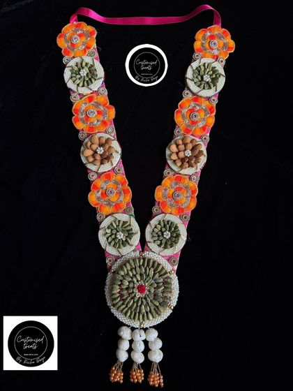 Another variation of my popular elaichi and almond garland, this one with bright orange floral details.