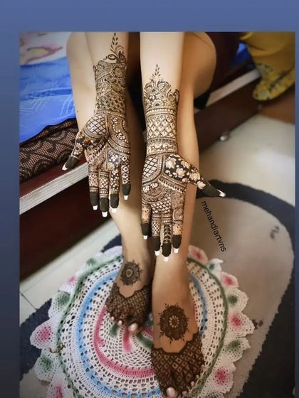 This client chose a coordinated set for her hands and feet, featuring intricate patterns on the arms and elegant mandalas on the feet.