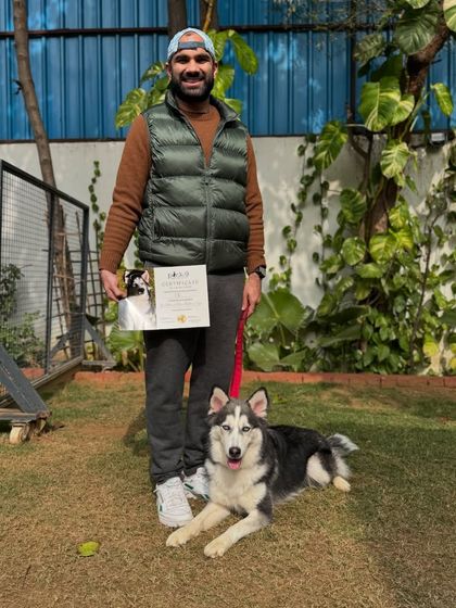 Obi looking proud on his graduation day. He learned to be more confident and less anxious in new situations.