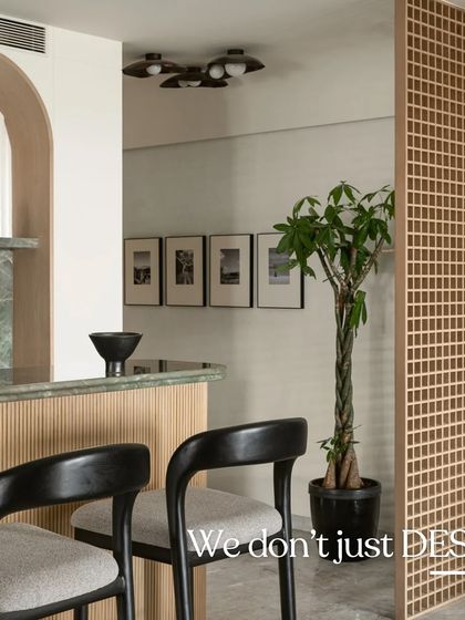 We don't just design, we create and execute. This image captures the finished bar and foyer partition, a testament to our team's ability to bring a vision to life.