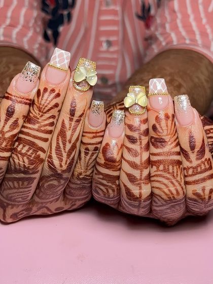 Another angle of this charming square-tip bridal set, showing the delicate gold chain detail around the butterfly charms.