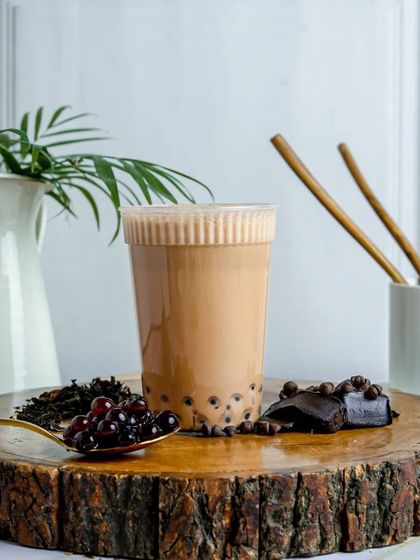 Another look at my signature Chocolate Milk Tea, a fan favorite. The rich chocolate flavor combined with chewy boba pearls makes for an unbeatable treat.
