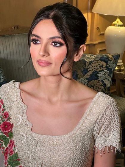 A soft, messy updo with loose tendrils for a romantic and modern feel.